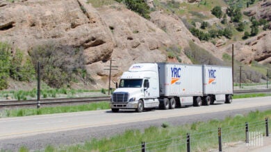 a YRC tractor with a Yellow trailer