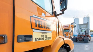 Yellow trucks parked at a terminal