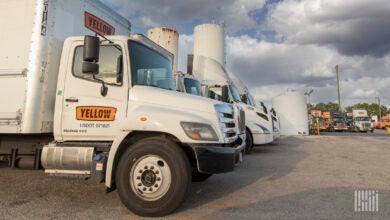 Yellow trucks parked at a terminal