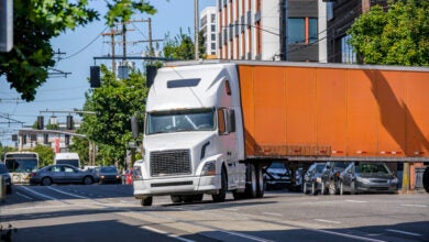 Truck making turn on city street