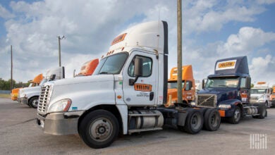 Yellow trucks parked at a shuttered terminal in Houston