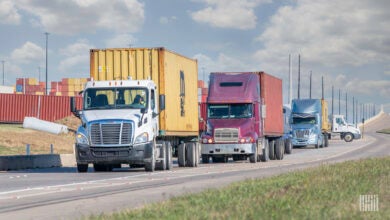 Tractors pulling containers out of a port