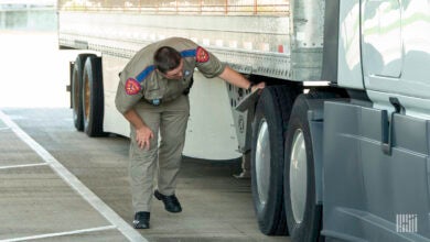 Roadside truck inspector inspecting truck