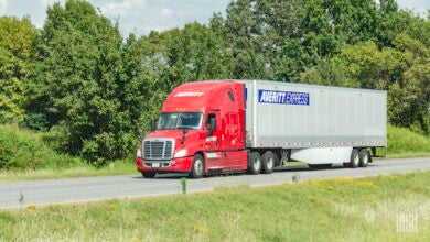 A red Averitt tractor pulling a 53-foot dry van trailer