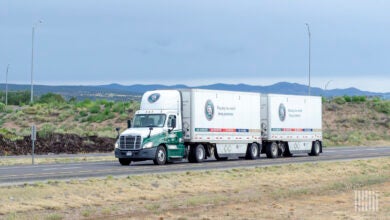 An Old Dominion tractor pulling two LTL trailers on highway