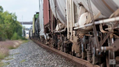 A close up of the wheels of a freight train as it rolls down the track.