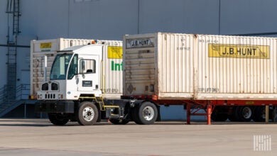 J.B. Hunt intermodal containers with a yard truck at a warehouse