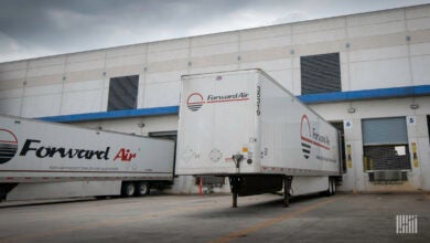 White Forward Air trailers at a loading dock