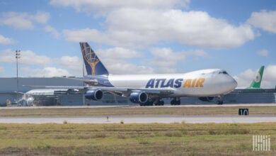 A large Atlas Air jumbo jet on the ground.