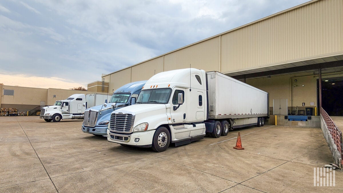 Tractor-trailers at a warehouse