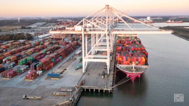 Container ship docked at port.