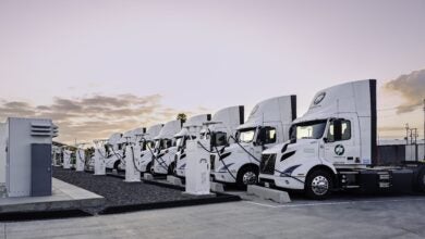 A photo of Performance Team tractors charging at a Prologis Mobility station.