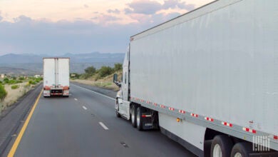 Two 53-foot trailers being pulled on a highway