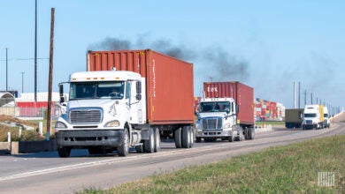 Trucks leaving a port with containers