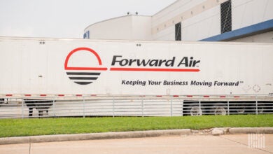 A side view of a Forward Air trailer at a warehouse