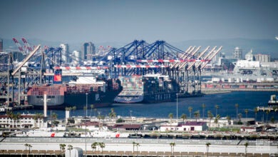 Images shows containers, container cranes, ships and buildings at the Port of Long Beach, California.