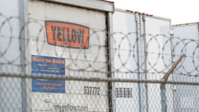 Trailers parked along a fence at a Yellow terminal