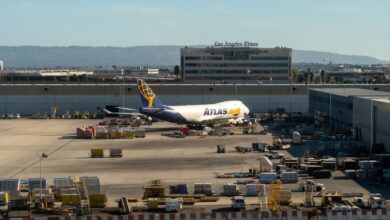 An Atlas Air jumbo jet is parked at an LAX cargo terminal.