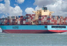 Image shows Maersk container ship in the ocean.