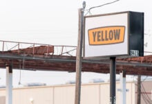 A Yellow sign near a terminal