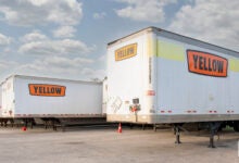 Yellow trailers parked at a Houston terminal