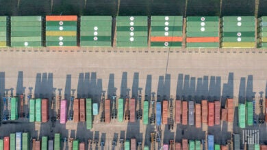 An overhead view of containers and chassis at a rail yard