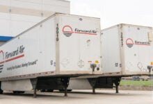 Two Forward Air trailers at an airport facility