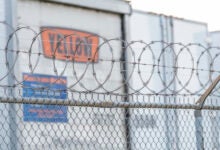 Yellow's trailers parked along a fence at a terminal