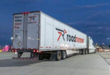 A Roadrunner tractor-trailer at a truckstop