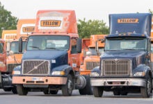 Yellow's tractors parked in a yard