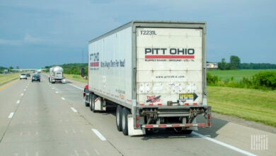 a rearview of a Pitt Ohio trailer on a highway