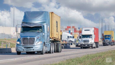 Trucks leaving a port with containers