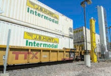 J.B. Hunt intermodal containers double stacked on a well car