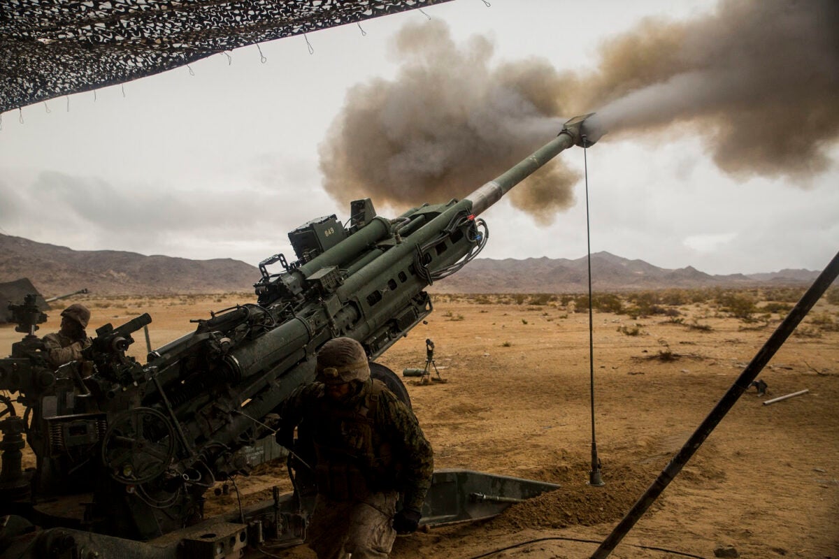 M777A2 howitzer fires a 155 mm shell during training