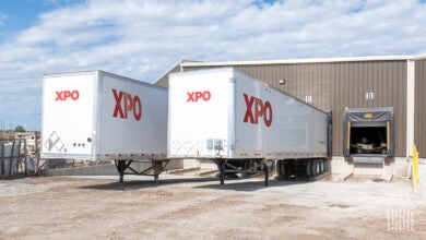 A pair of XPO trailers at a warehouse