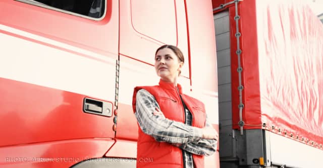 Female truck driver standing outside her rig. (Photo credit: Twitter)