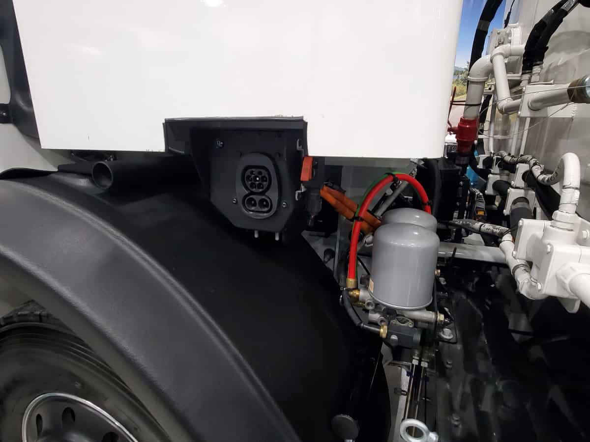 Mack LR Electric refuse truck charging plug view
