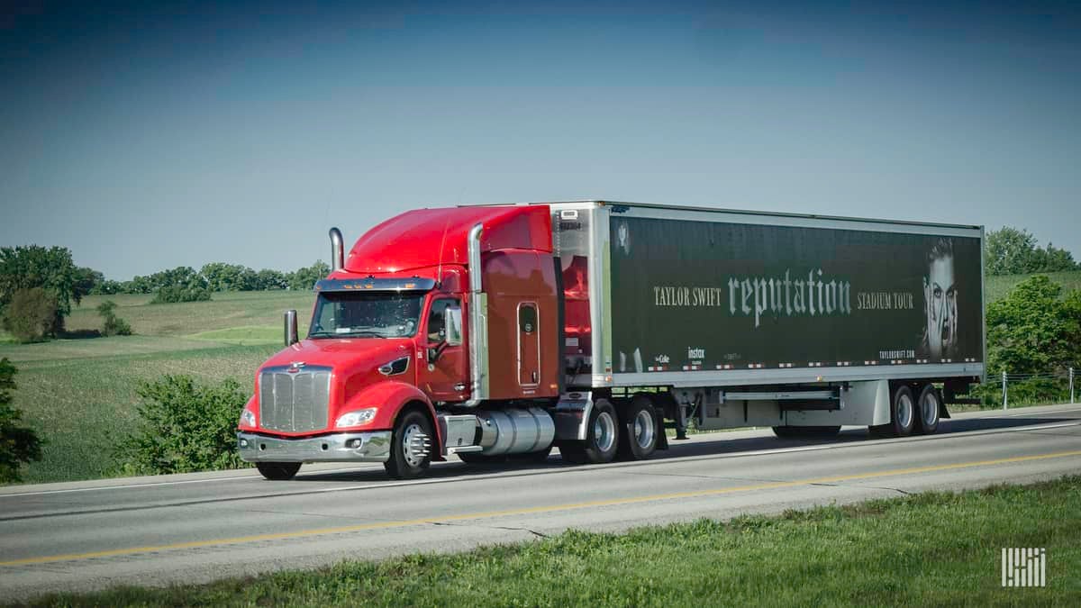 Photo of 18-wheeler truck. On the trailer is a photo of Taylor Swift and the caption "Taylor Swift Reputation."