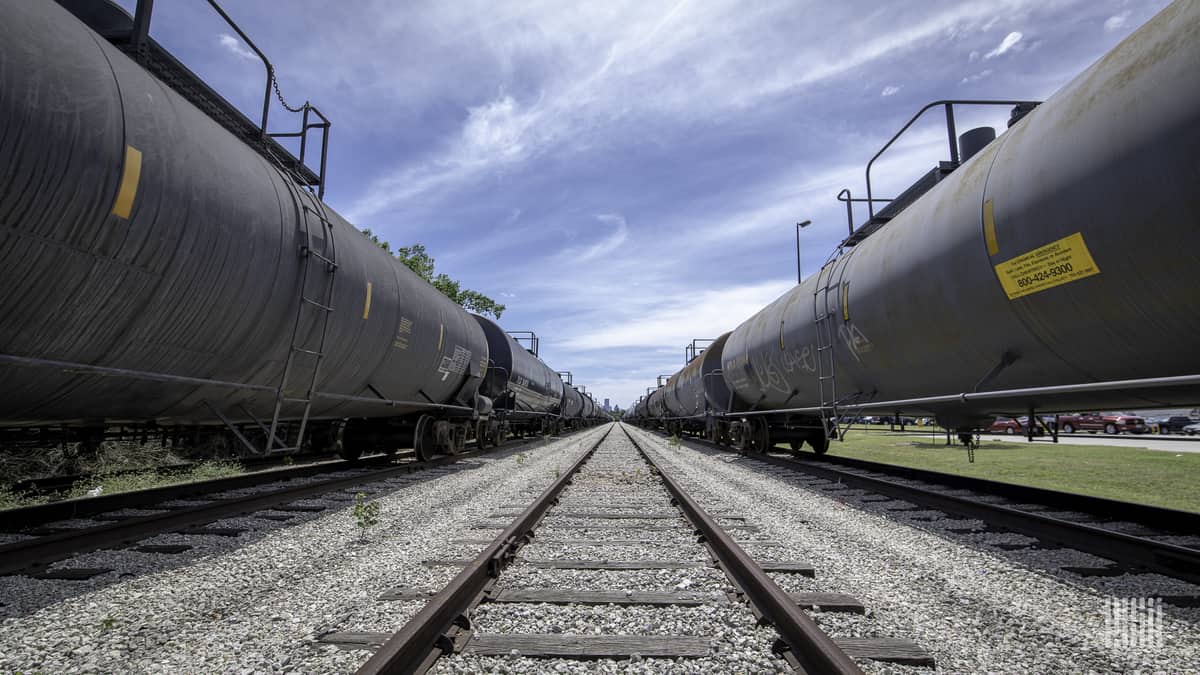 Tank cars sit on two of three tracks visible in this photo