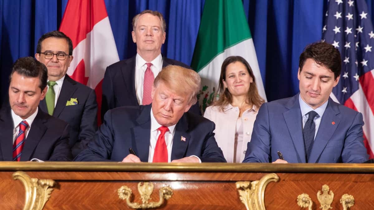 The leaders of Mexico, the United States and Canada sign the USMCA.