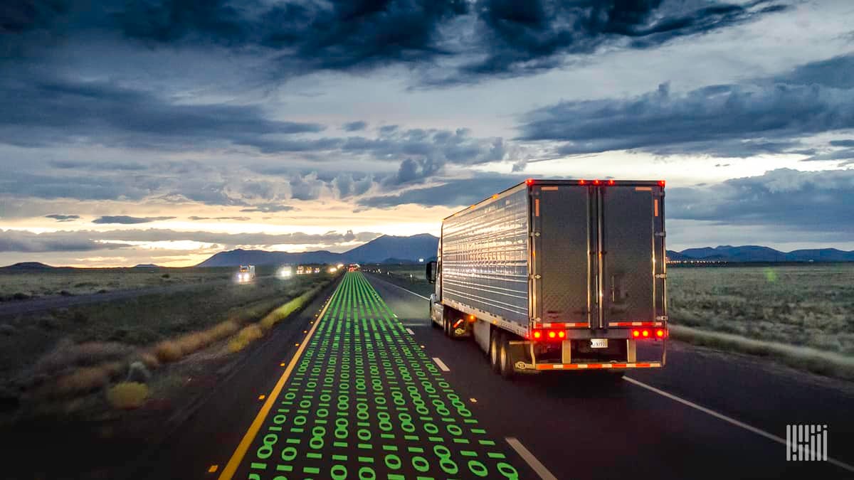 Truck driving on highway at dusk