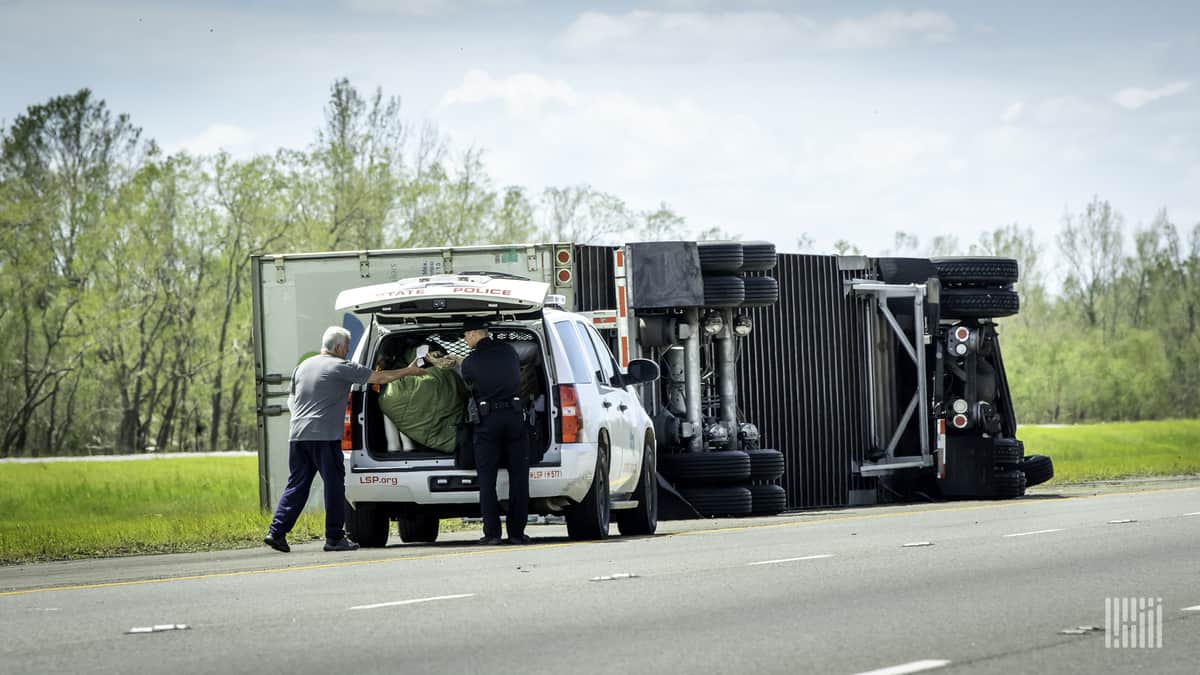 Overturned truck on side of highway