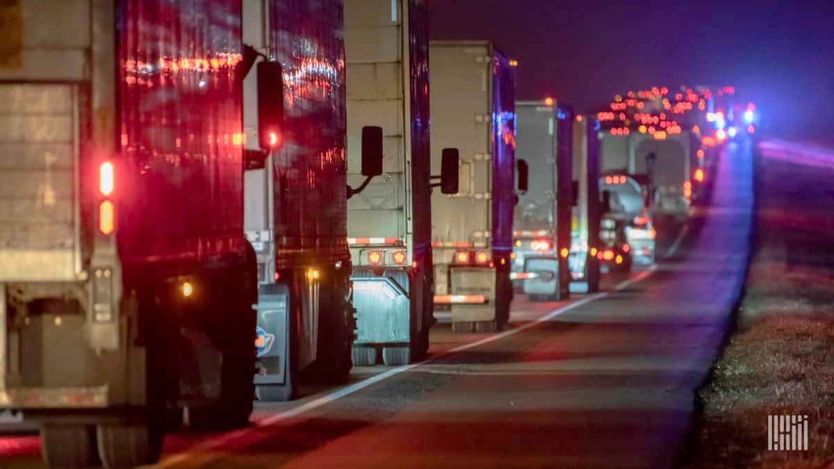 Trucks in highway traffic at night