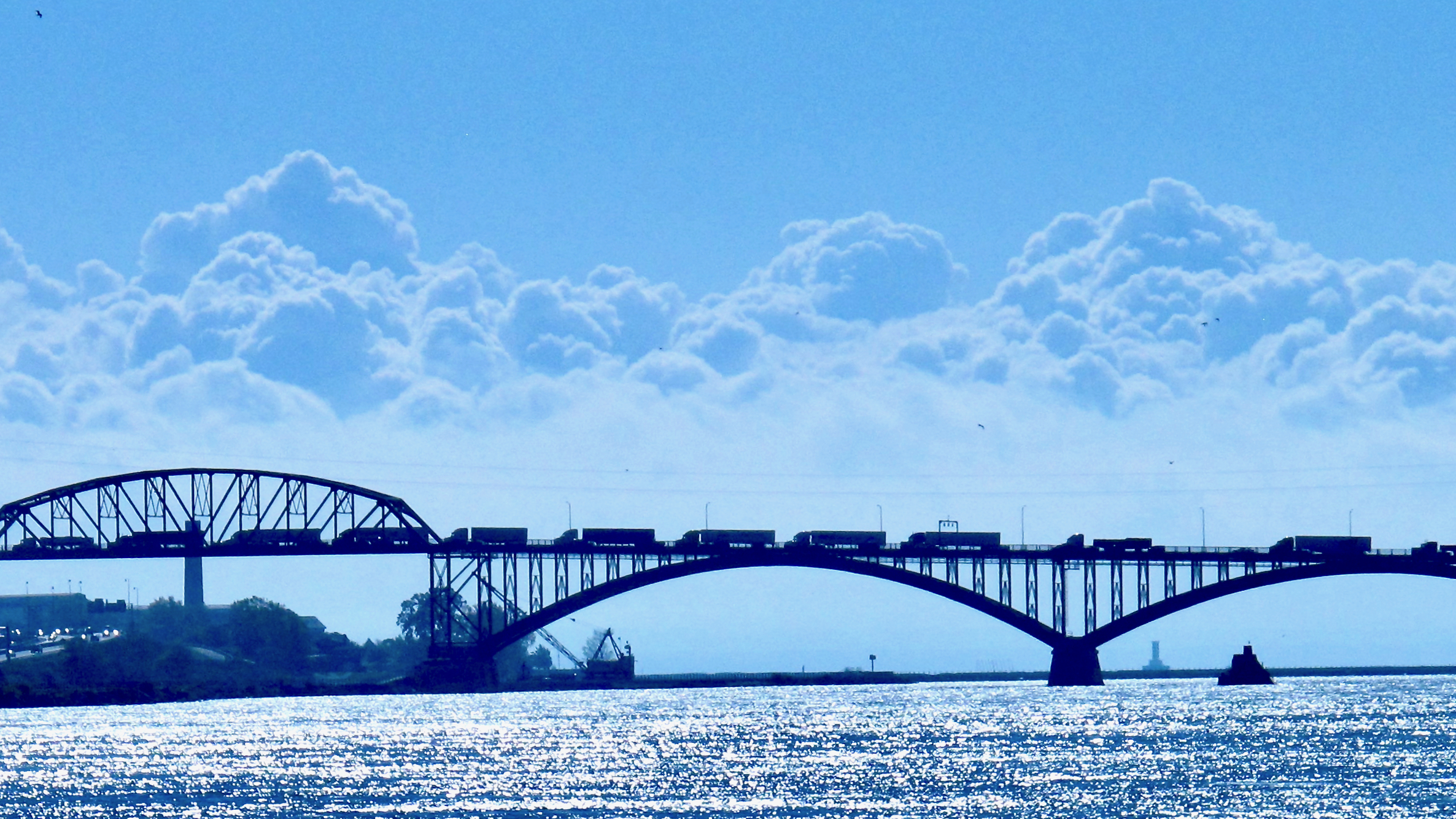 Multiple commercial trucks move along the Peace Bridge, a common site of marijuana seizures at the U.S. Canada Border.