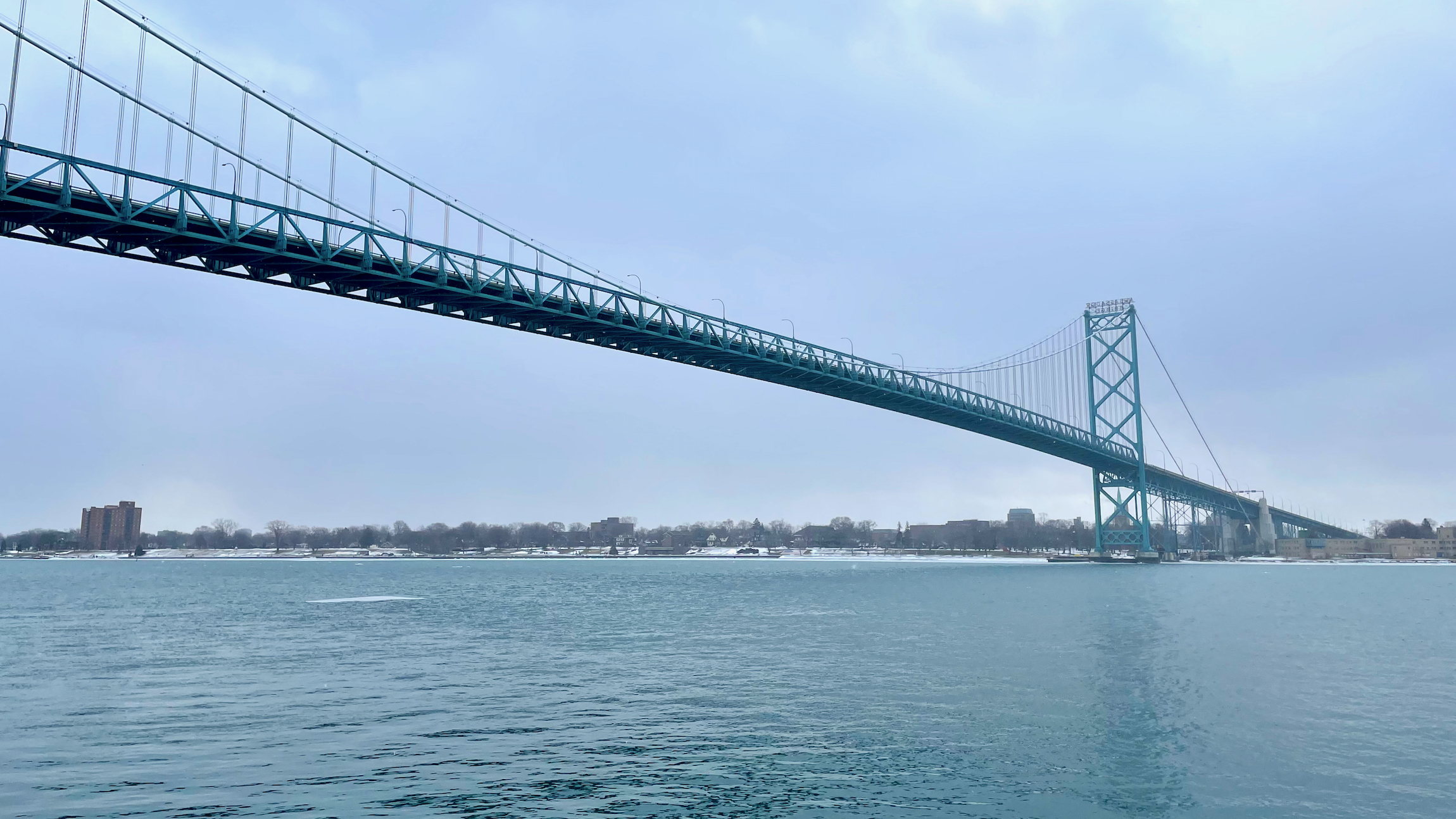 A view of the Ambassador Bridge, a suspension bridge, from below, which has no traffic on it because of a protest