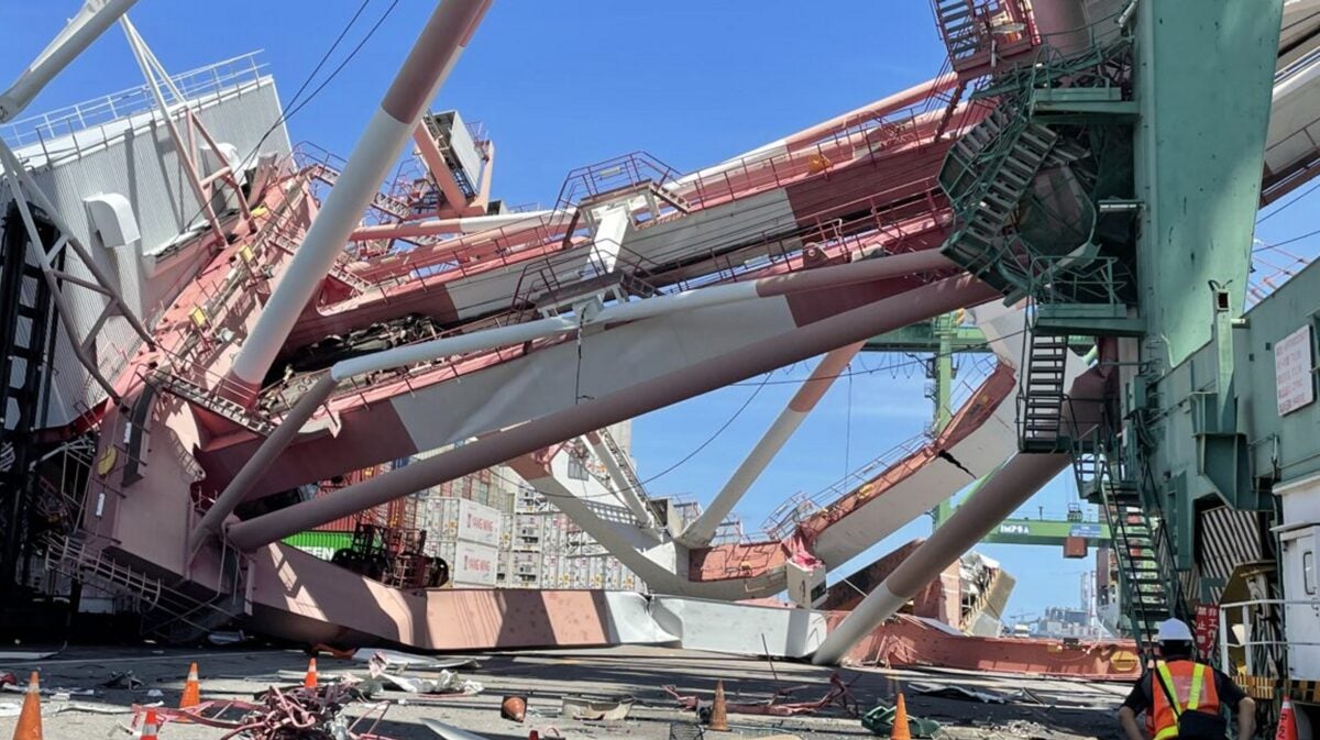 Container ship OOCL Durban knocked over a gantry crane 