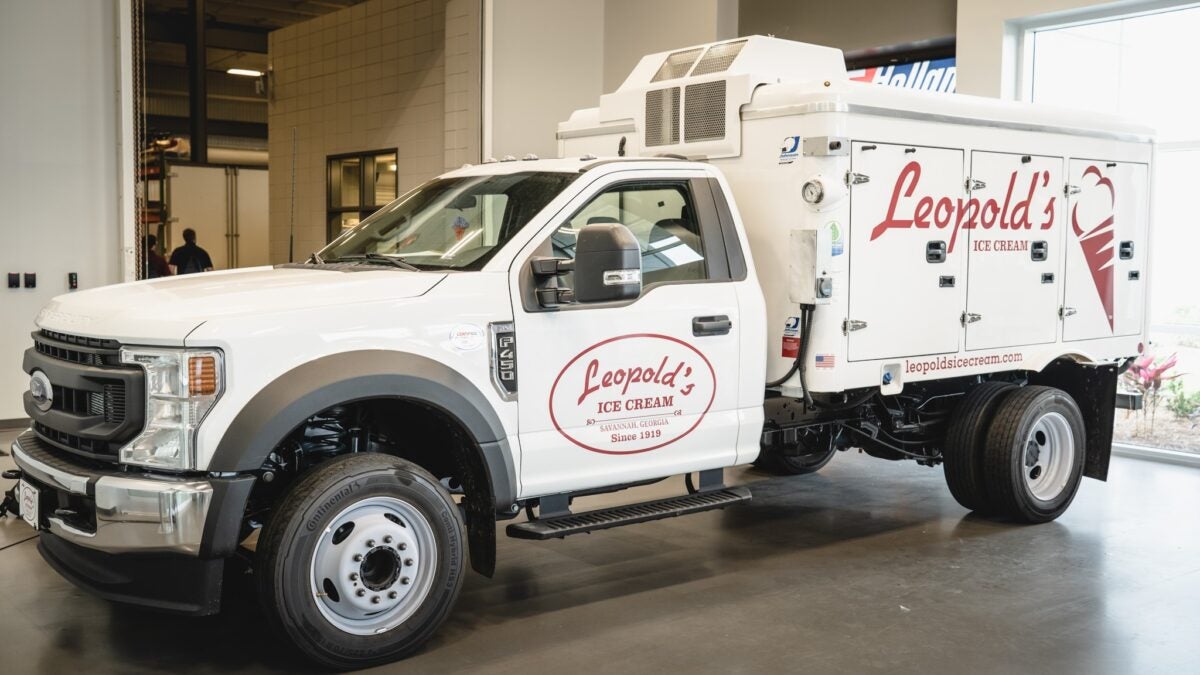 A white Leopold's ice cream truck with a refrigeration unit from Great Dane.