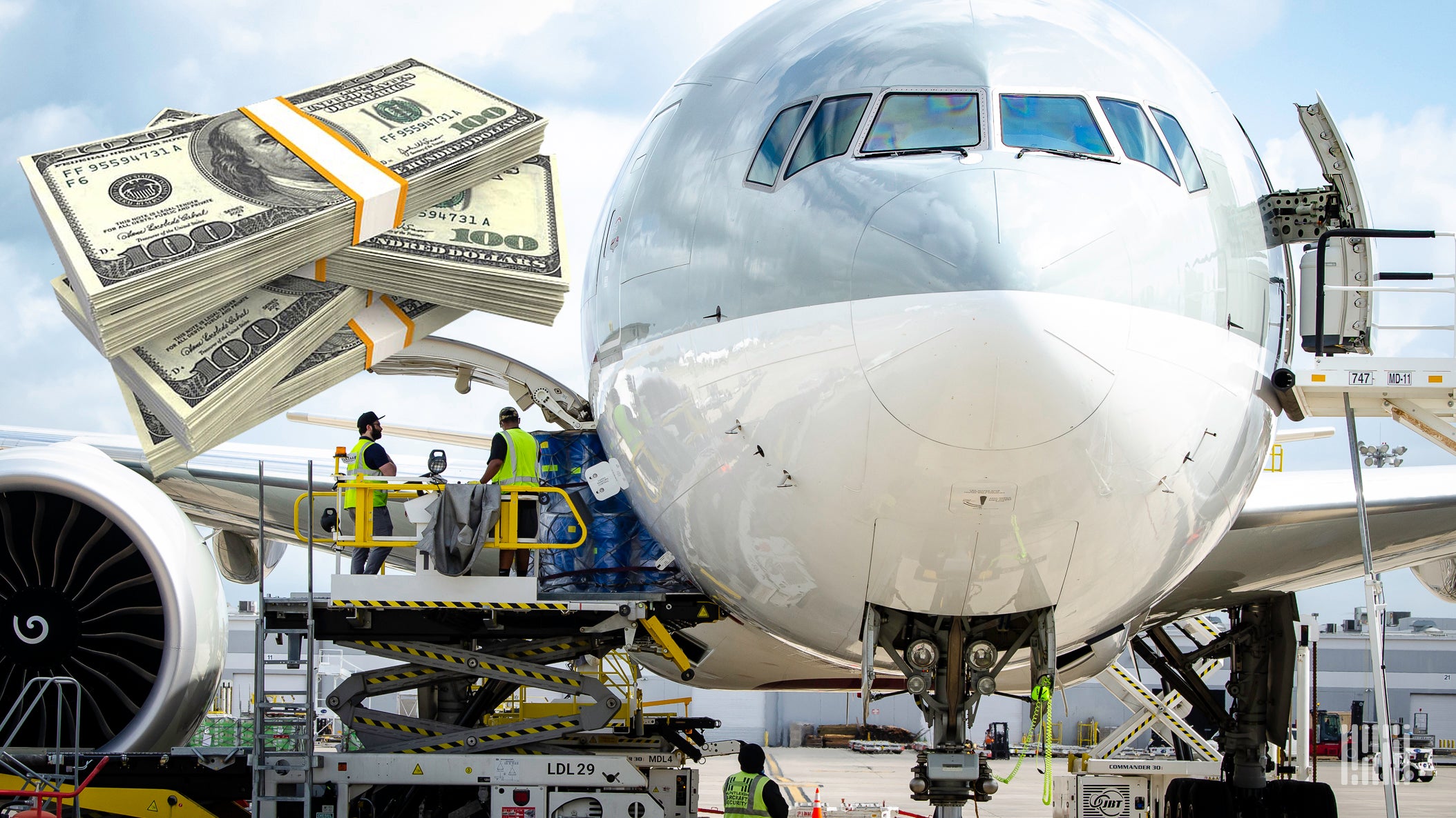 Front close up of a large jet with cargo being loaded on the side and stacks of dollars superimposed on the side.