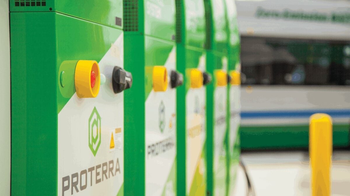 Row of green, yellow and white Proterra Energy chargers