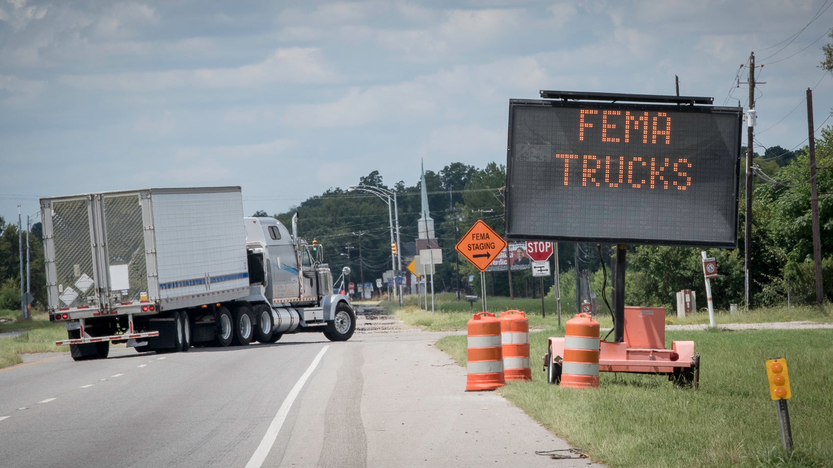 trucks and FEMA traffic sign